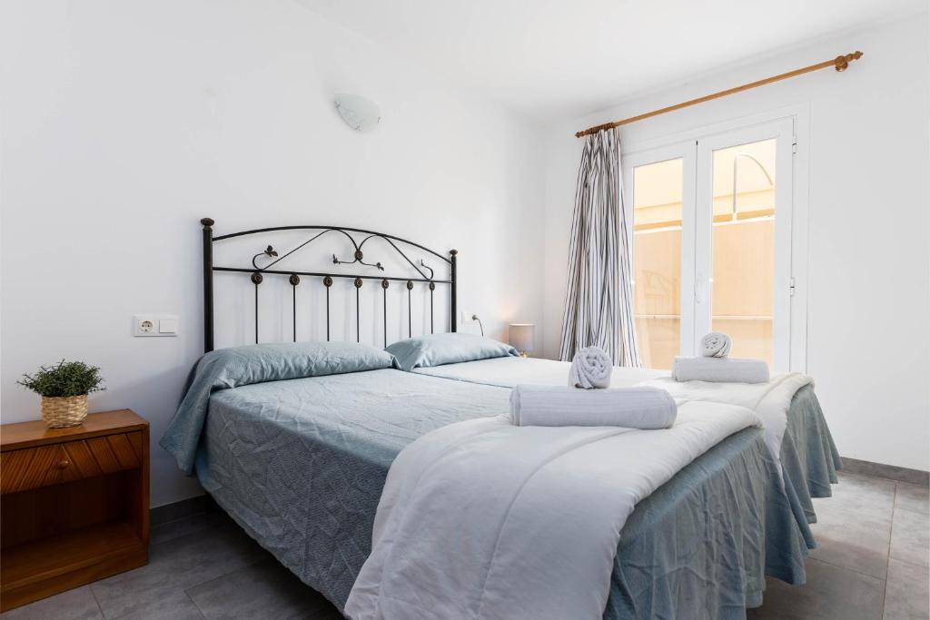 Posteľ alebo postele v izbe v ubytovaní Acapulco Apartments