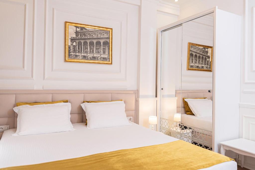 Postel nebo postele na pokoji v ubytování Eler Hotel