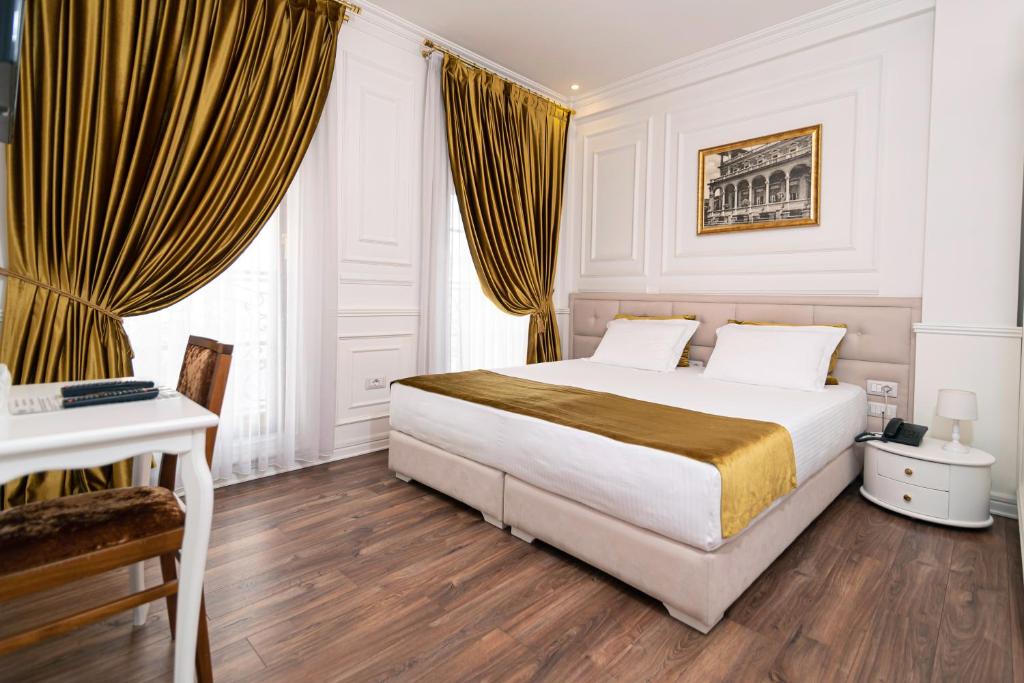 Postel nebo postele na pokoji v ubytování Eler Hotel