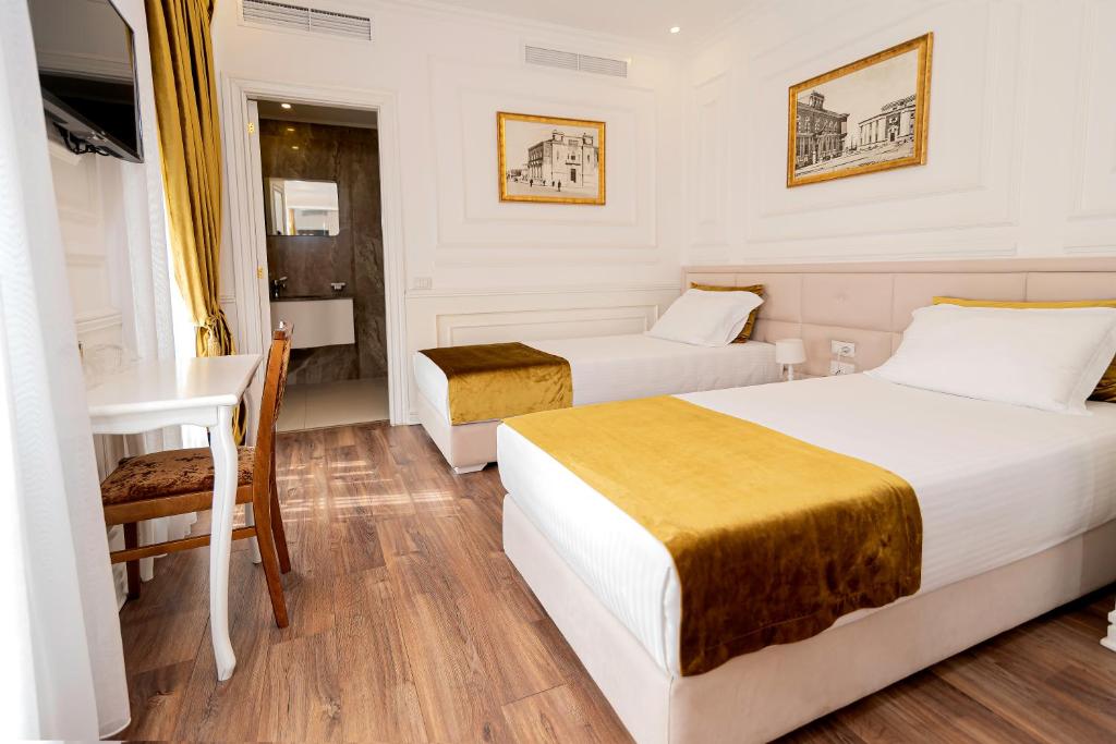 Postel nebo postele na pokoji v ubytování Eler Hotel