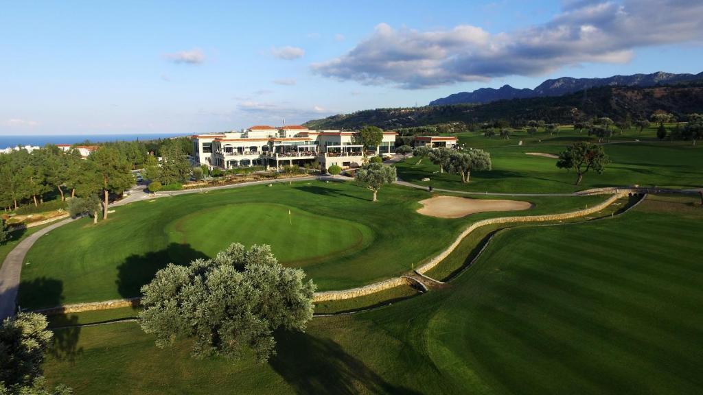 an aerial view of the golf course at a resort at Korineum Golf & Beach Resort in Kyrenia