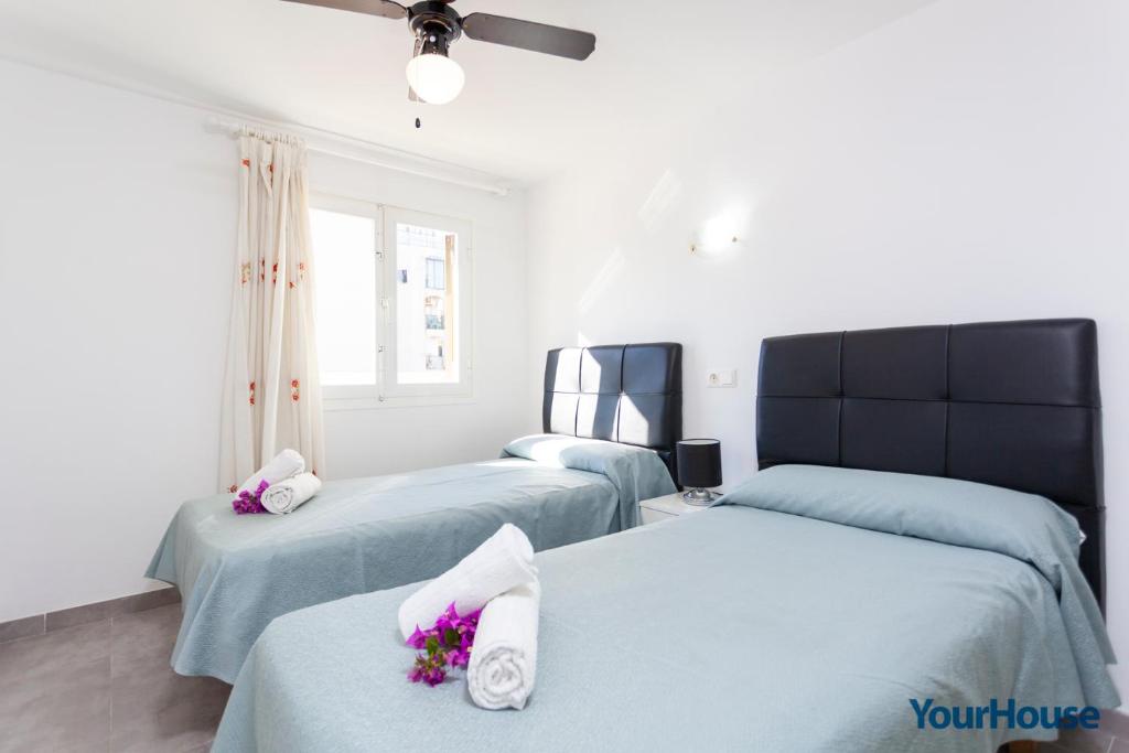 Posteľ alebo postele v izbe v ubytovaní Acapulco Apartments