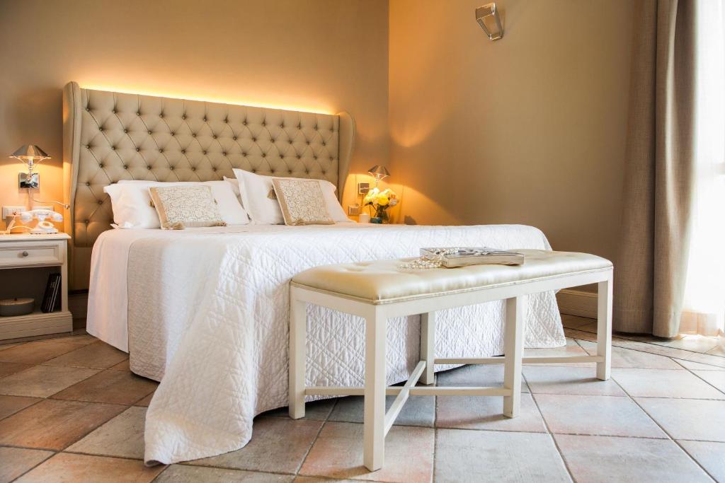 Łóżko lub łóżka w pokoju w obiekcie Hotel Savoia