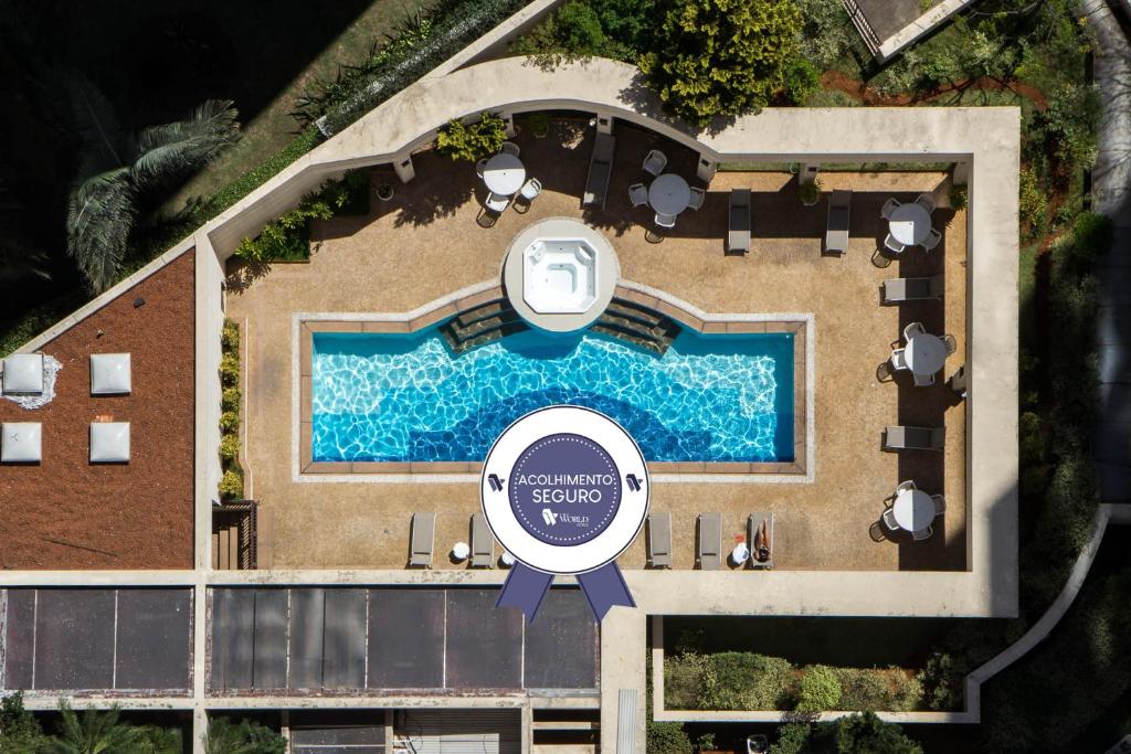 an overhead view of a pool at a resort at The World Vila Olímpia in São Paulo