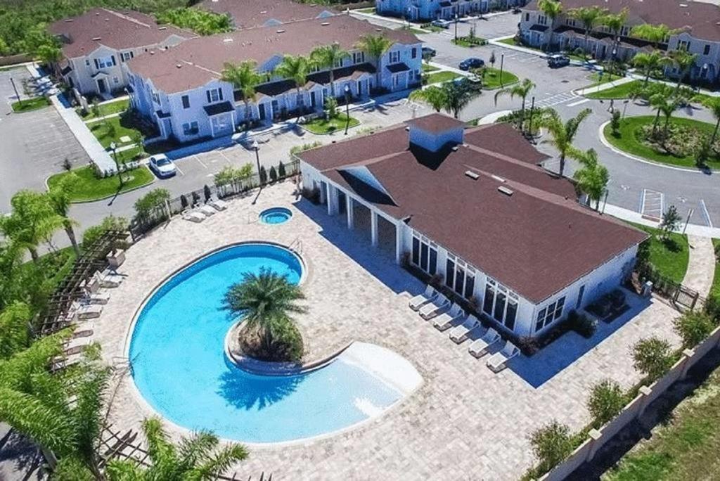 an aerial view of a pool at a resort at Great And Practical Townhouse In Gated Community, Sleeps 6 10 Min To Disney! in Orlando