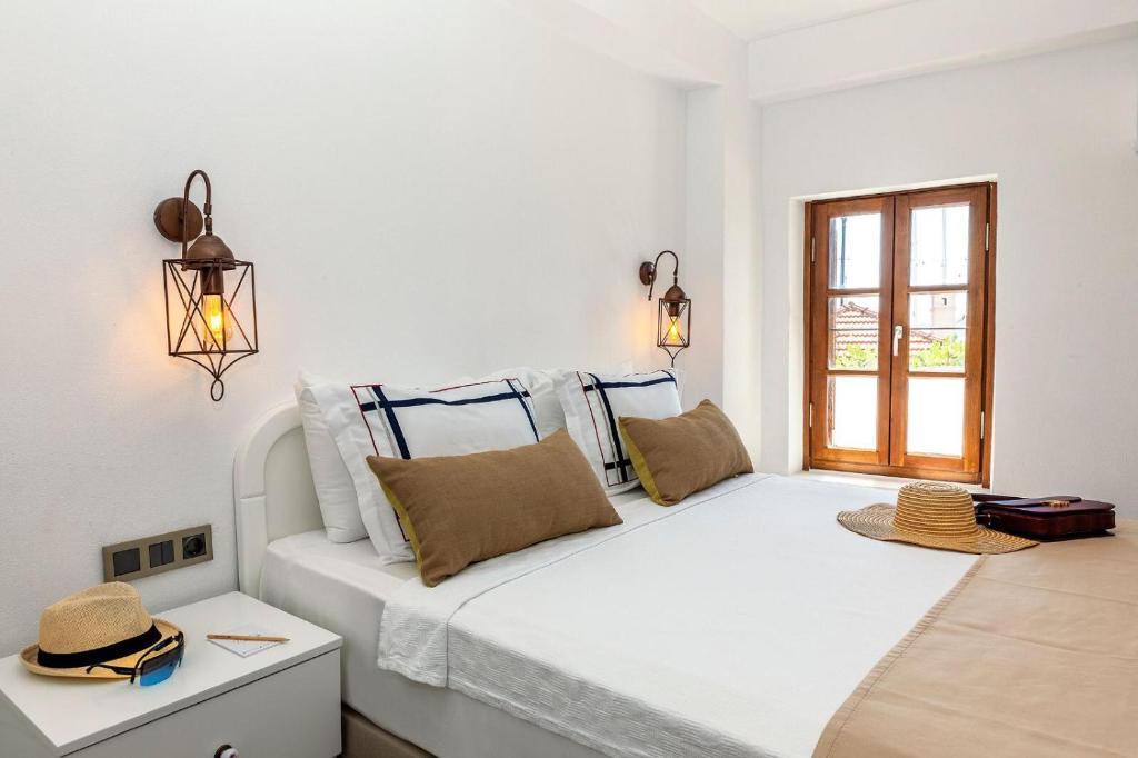 Postel nebo postele na pokoji v ubytování Mets Boutique Hotel