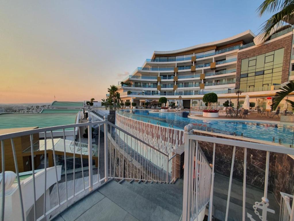 a balcony of a hotel with a swimming pool at Admiral Elite Residence in Alanya
