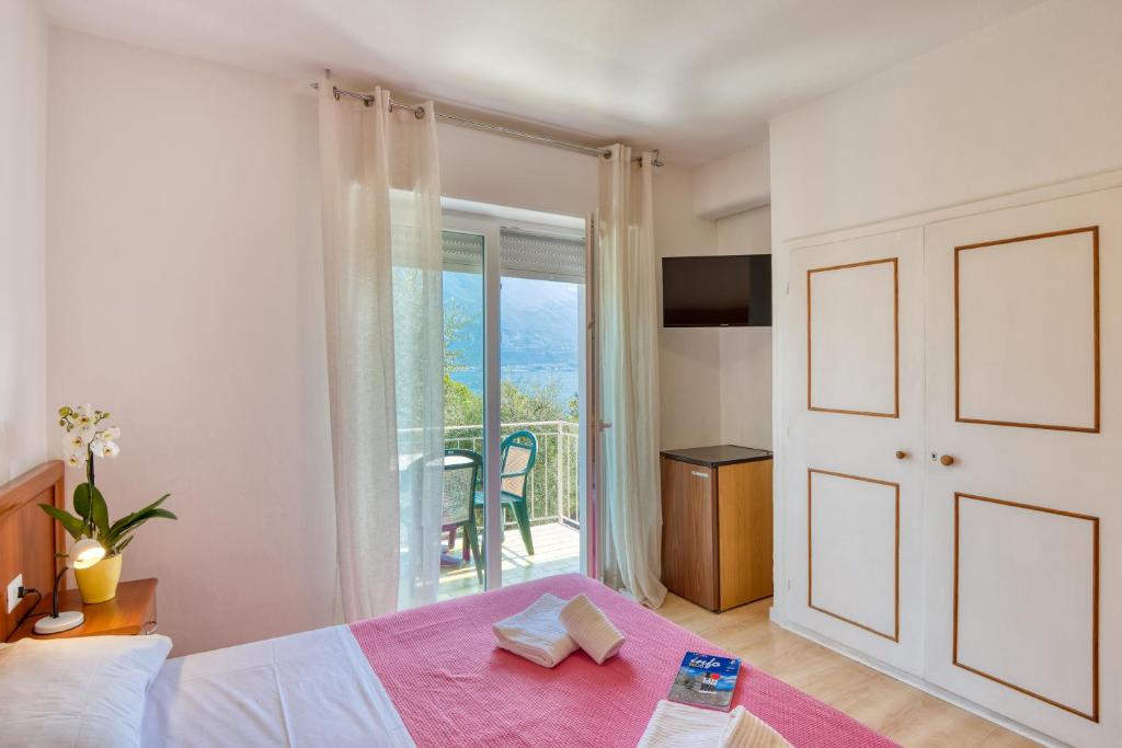 Postel nebo postele na pokoji v ubytování Hotel Casa Piantoni