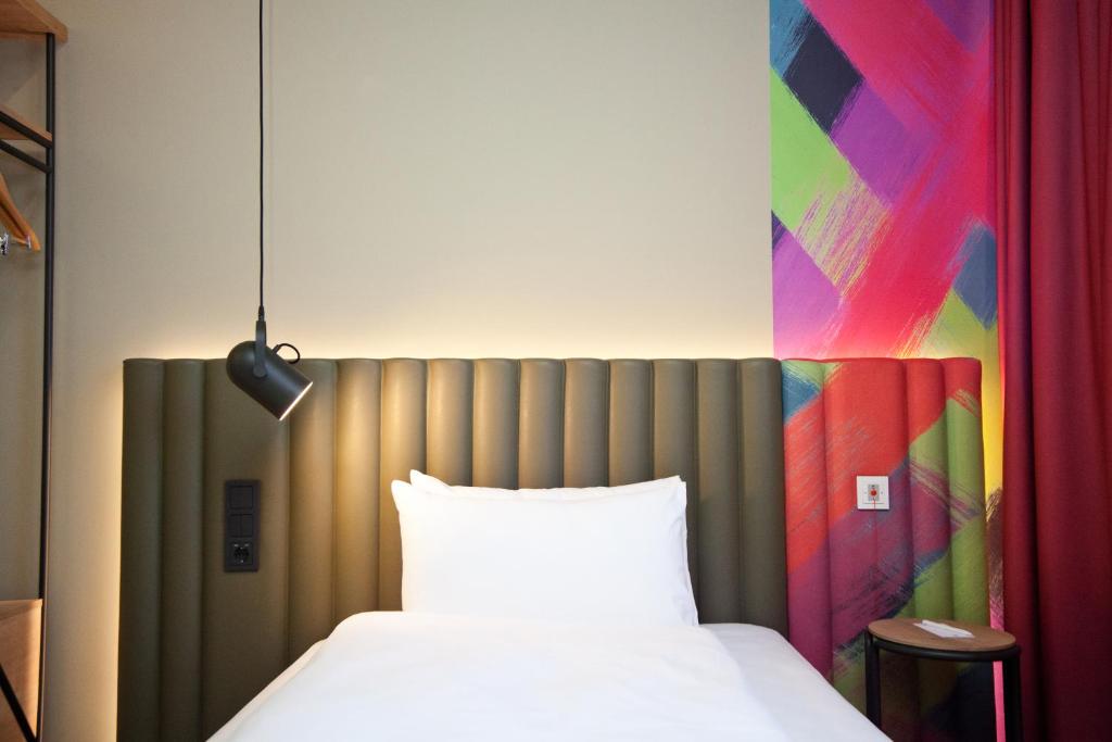 Posteľ alebo postele v izbe v ubytovaní ibis Styles Parndorf Neusiedler See