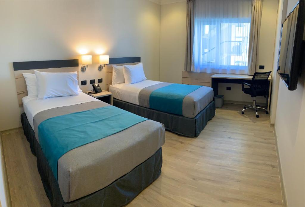 Una cama o camas en una habitación de Hotel Diego de Almagro Temuco Express