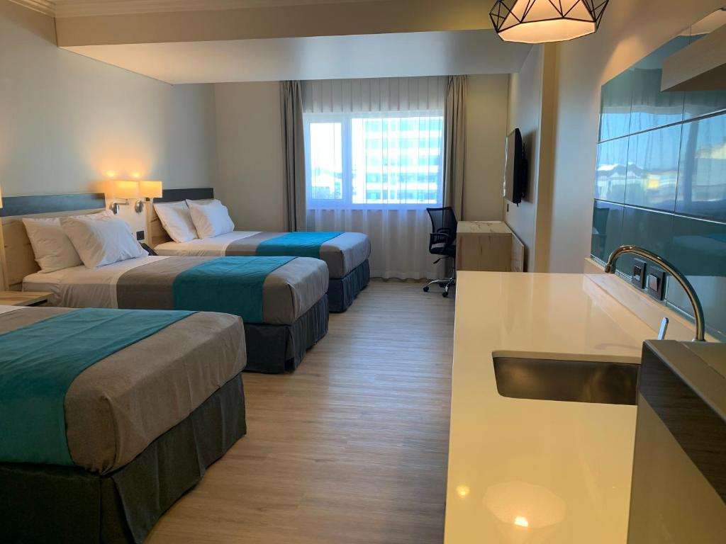 Una cama o camas en una habitación de Hotel Diego de Almagro Temuco Express