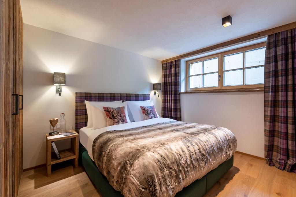 Postel nebo postele na pokoji v ubytování Brunnenhof Luxury Apartments
