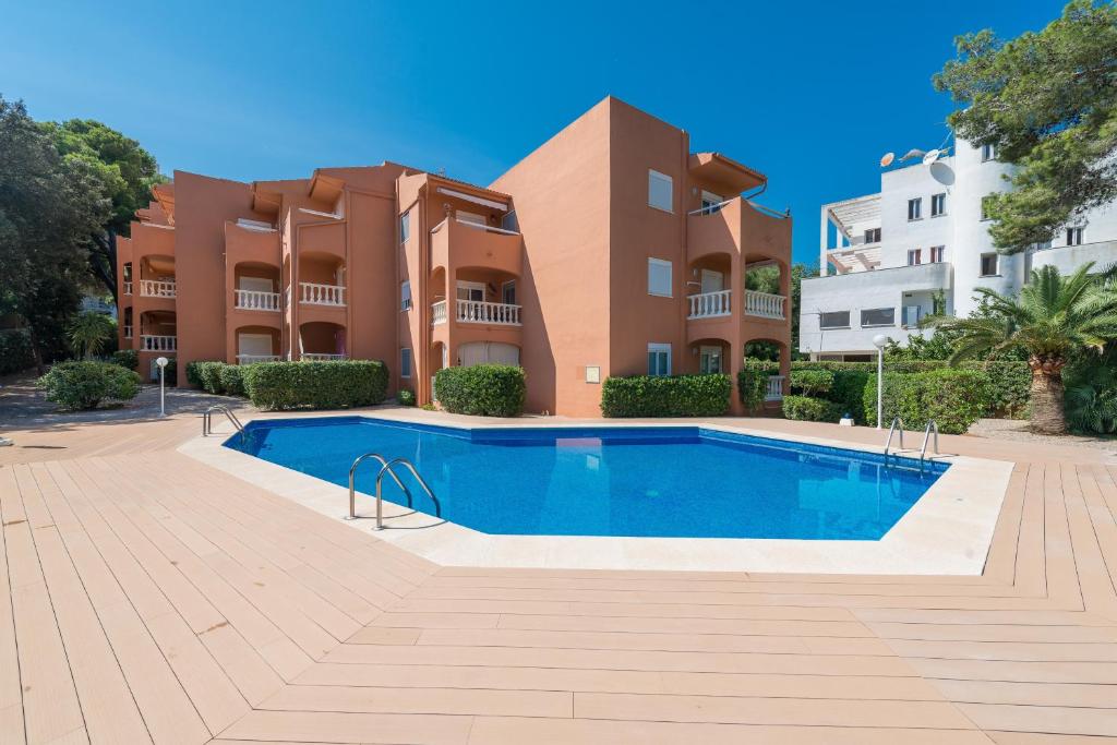 a swimming pool in front of a building at Canyamel Beach & Sun - Family vacation! in Canyamel