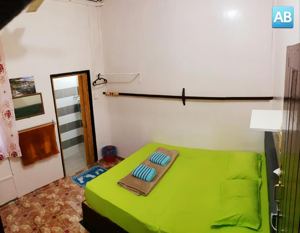 Postel nebo postele na pokoji v ubytování Perhentian AB Guest House