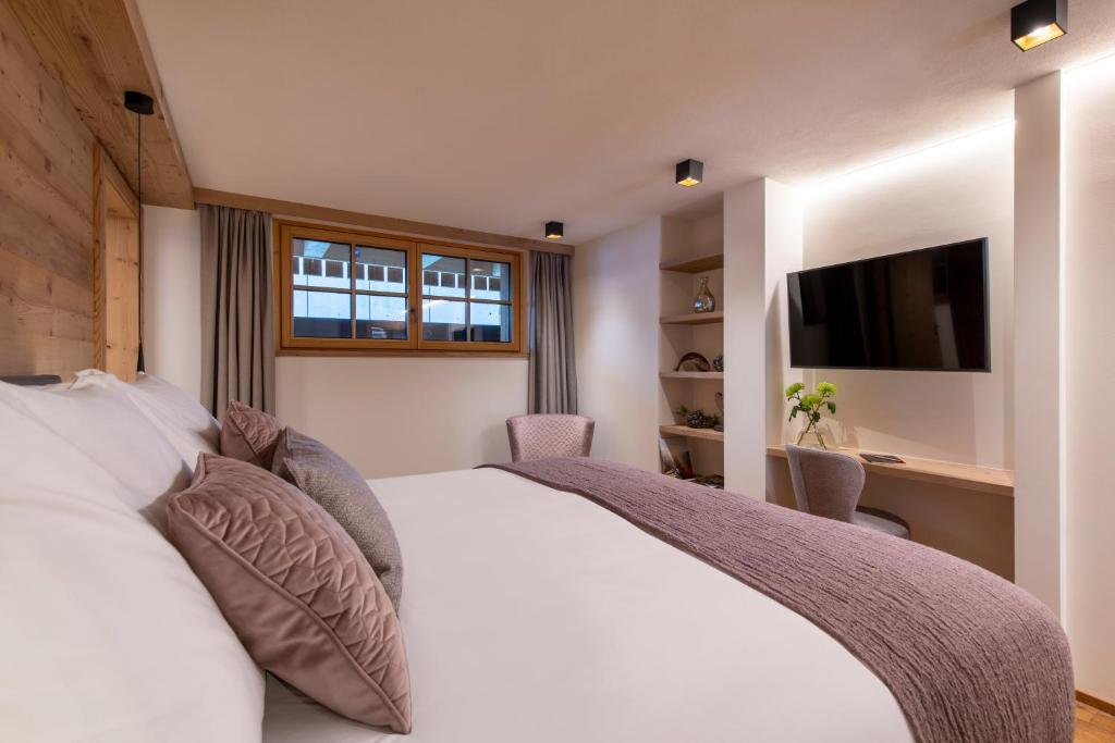 Postel nebo postele na pokoji v ubytování Brunnenhof Luxury Apartments