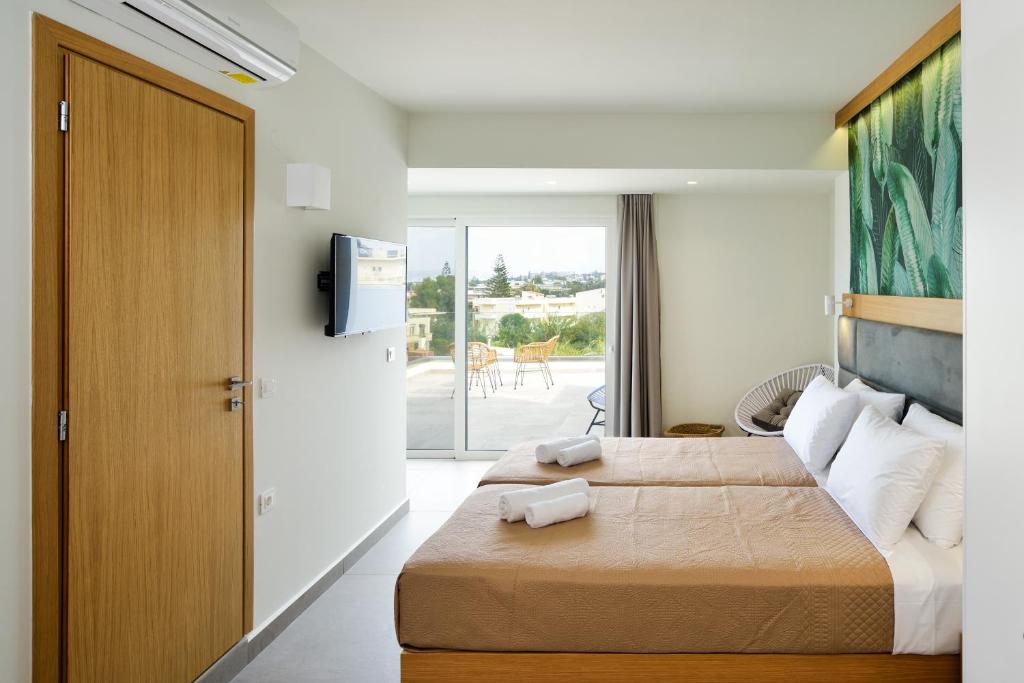 Postel nebo postele na pokoji v ubytování Elia Kalamaki Hotel