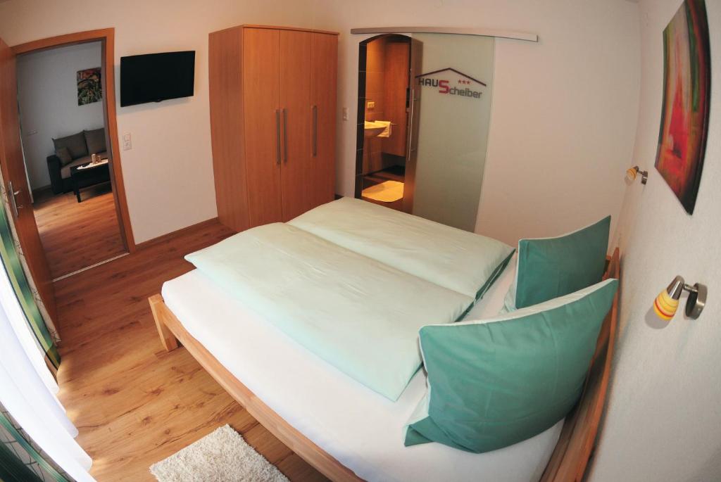 Postel nebo postele na pokoji v ubytování Haus Scheiber
