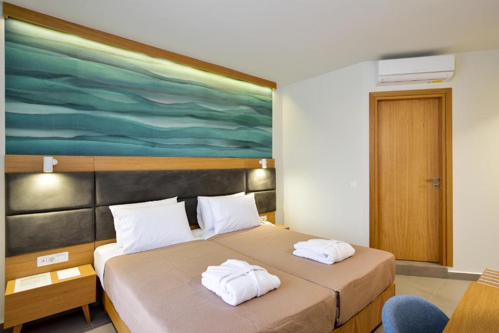 Postel nebo postele na pokoji v ubytování Elia Kalamaki Hotel