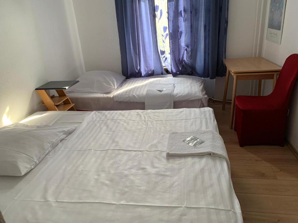 En eller flere senge i et værelse på Märkischer Hof Hotel