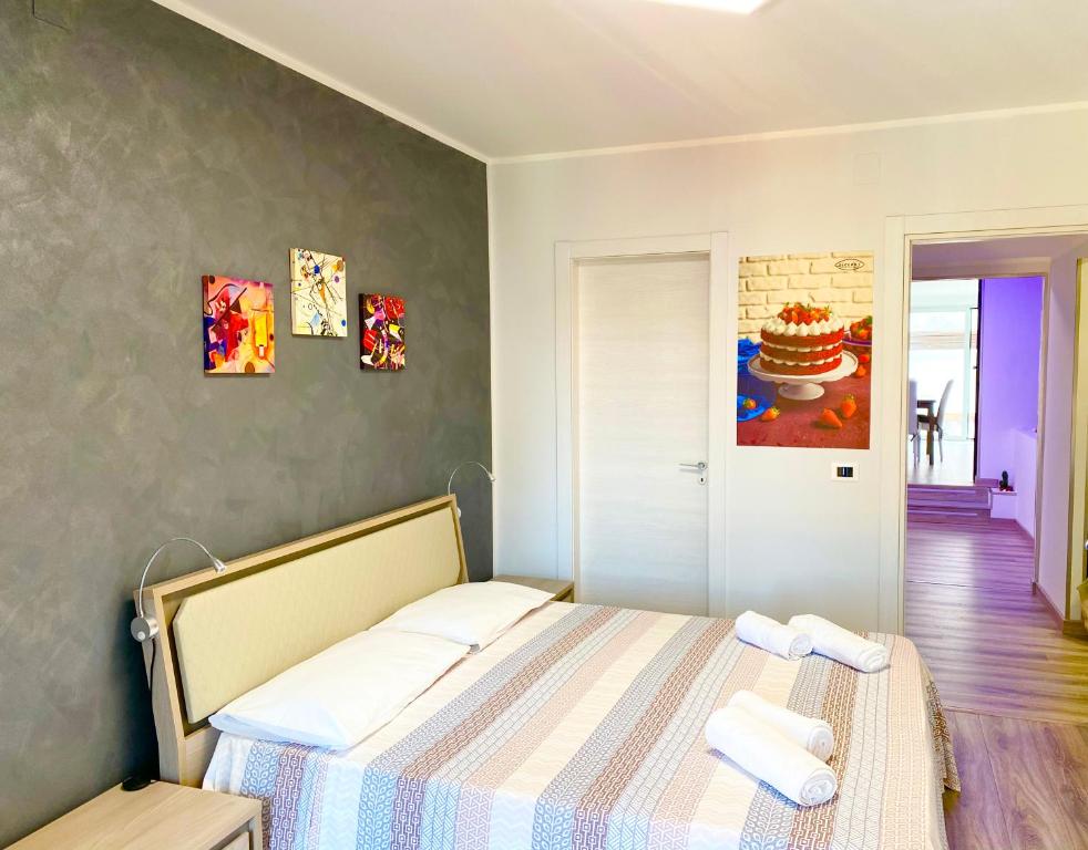 Postel nebo postele na pokoji v ubytování Siclari B&B-Rooms&Suite