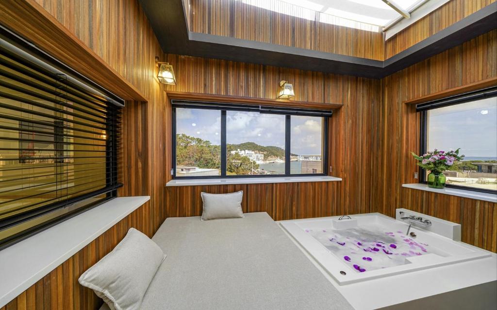 Postel nebo postele na pokoji v ubytování GijangYeonhwari No,25 Hotel