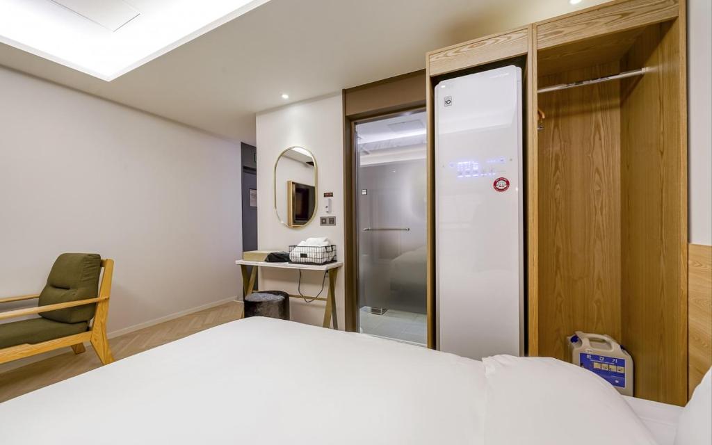 Postel nebo postele na pokoji v ubytování GijangYeonhwari No,25 Hotel