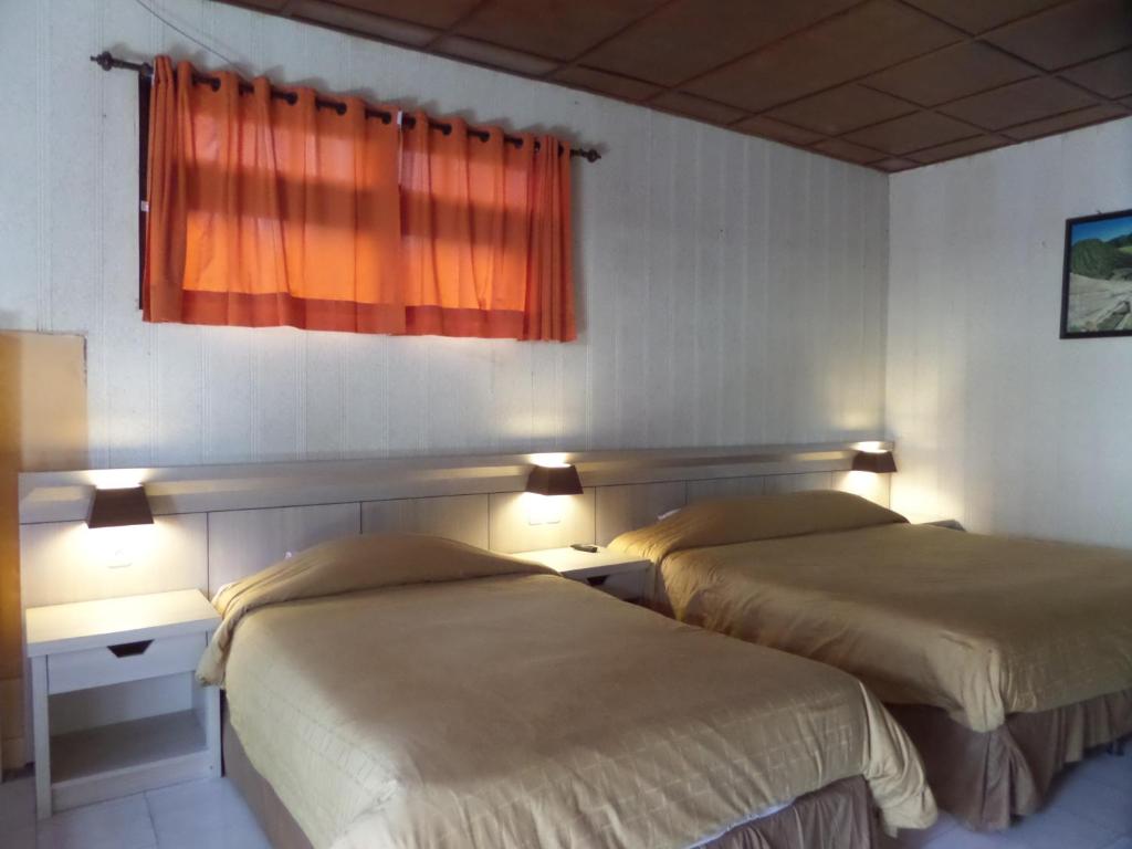 Postel nebo postele na pokoji v ubytování Bromo Permai 1