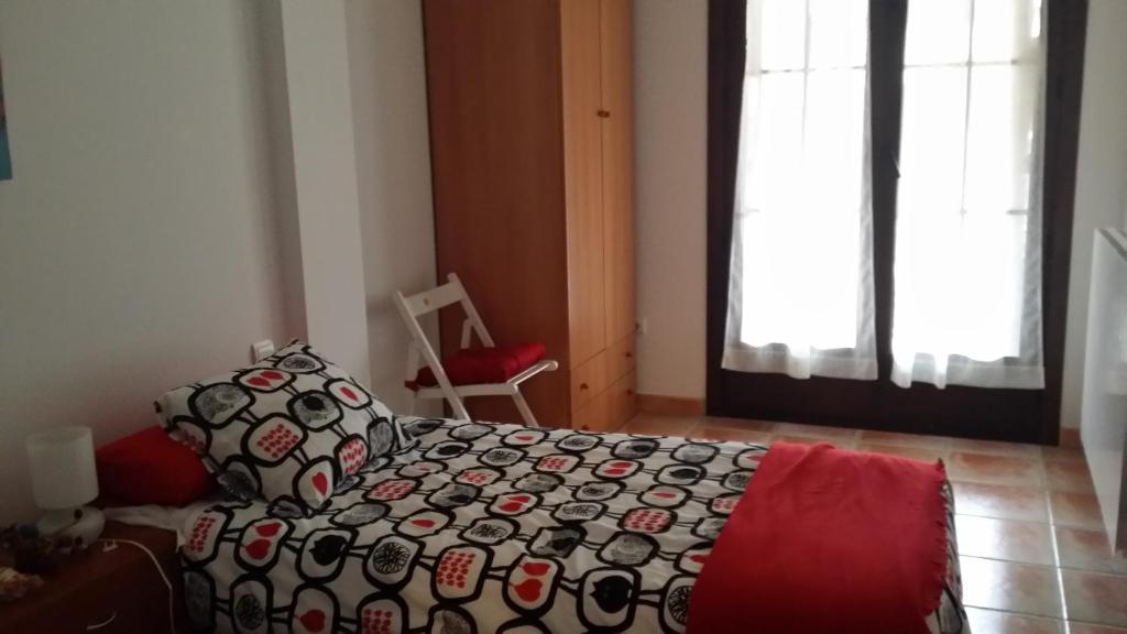 Postel nebo postele na pokoji v ubytování Apartamentos Portal de Ordesa
