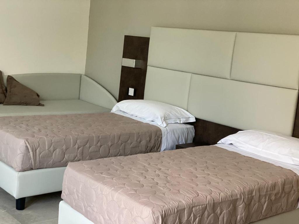 Postel nebo postele na pokoji v ubytování B&B Bertani