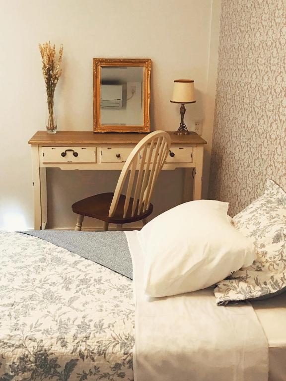 Postel nebo postele na pokoji v ubytování L'AtelieR Guest House Yonago