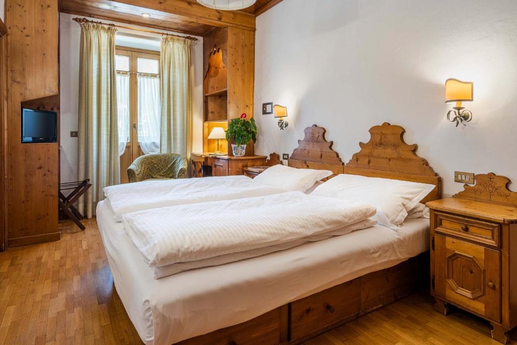 Postel nebo postele na pokoji v ubytování Franceschi Park Hotel