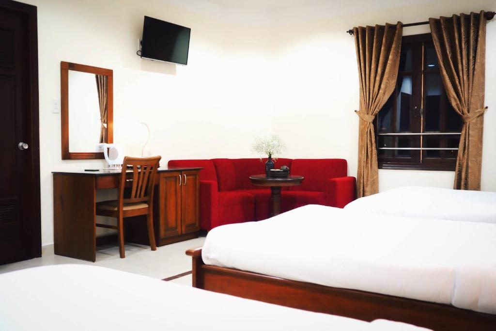 Cama ou camas em um quarto em Hùng Phong Hotel - Near Dalat Night Market