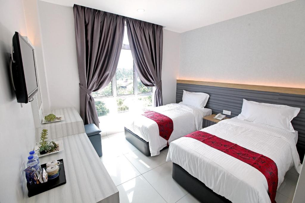 Postel nebo postele na pokoji v ubytování B&L HOTEl