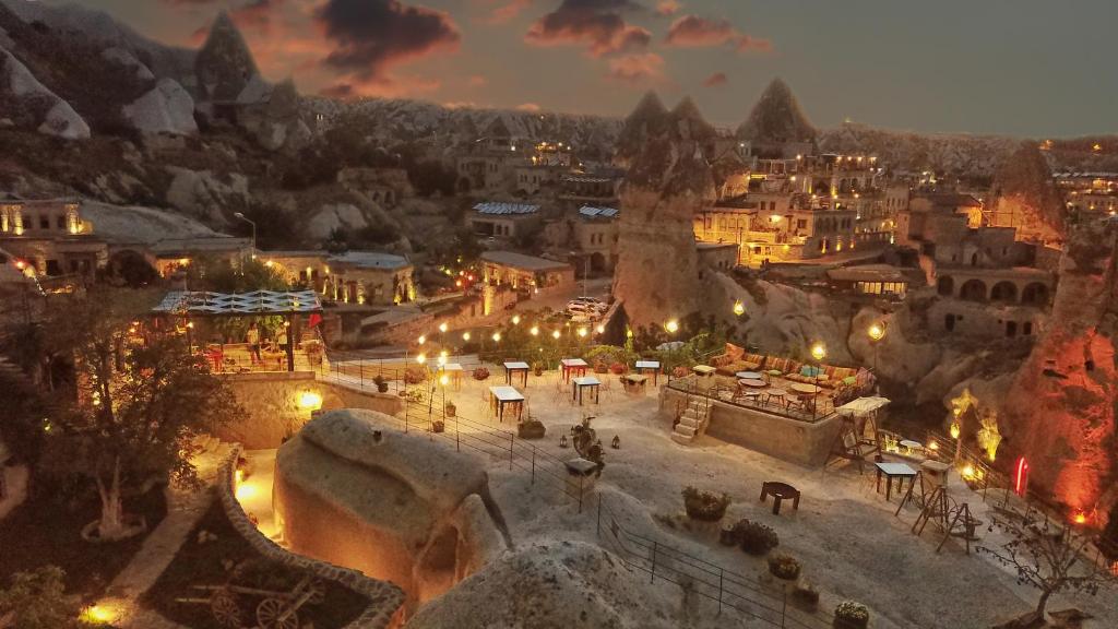 an aerial view of a city at night at Traveller's Cave Hotel in Göreme