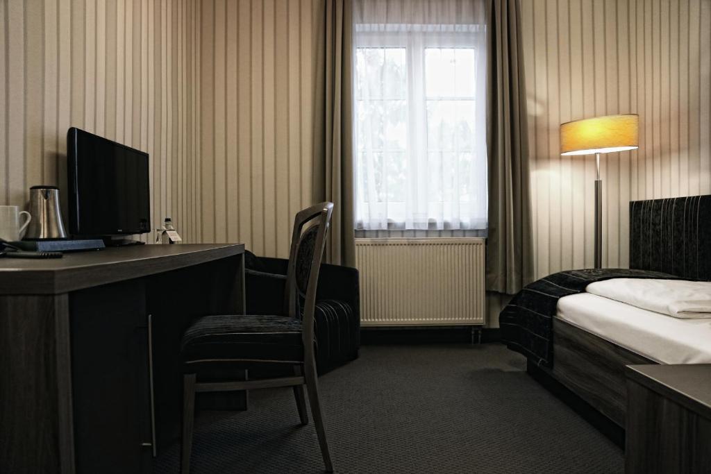 Letto o letti in una camera di Konsumhotel Dorotheenhof Weimar
