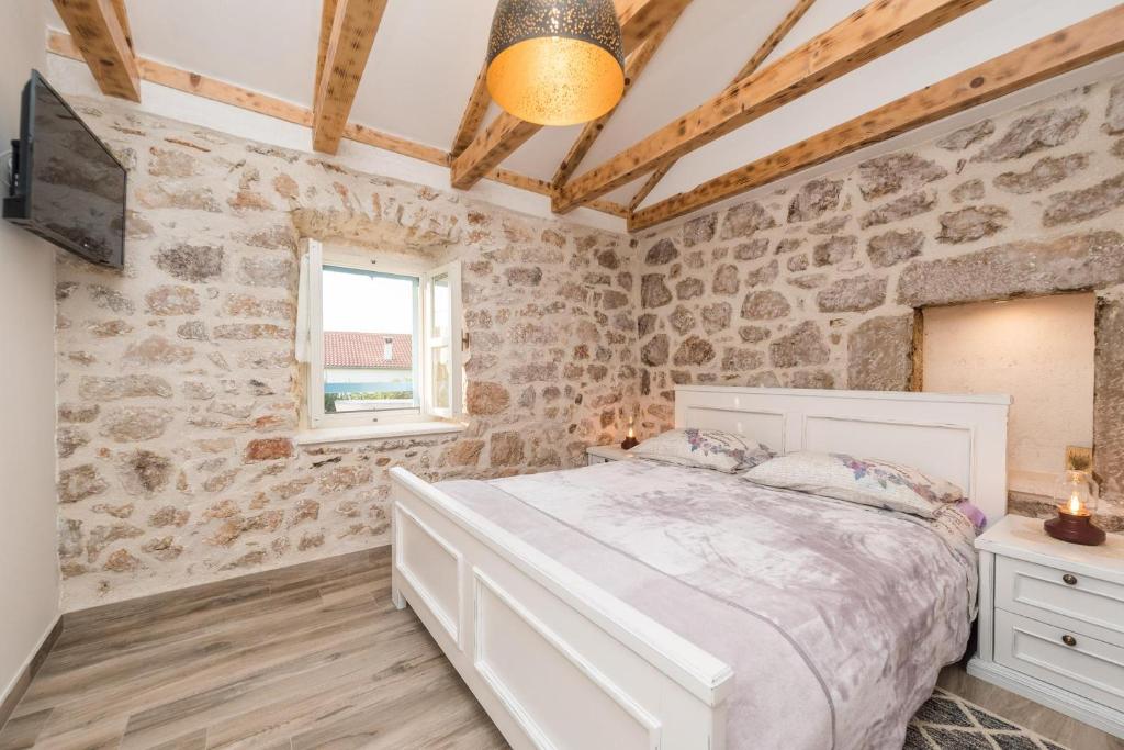 Postel nebo postele na pokoji v ubytování Holiday Home Lipa Naša