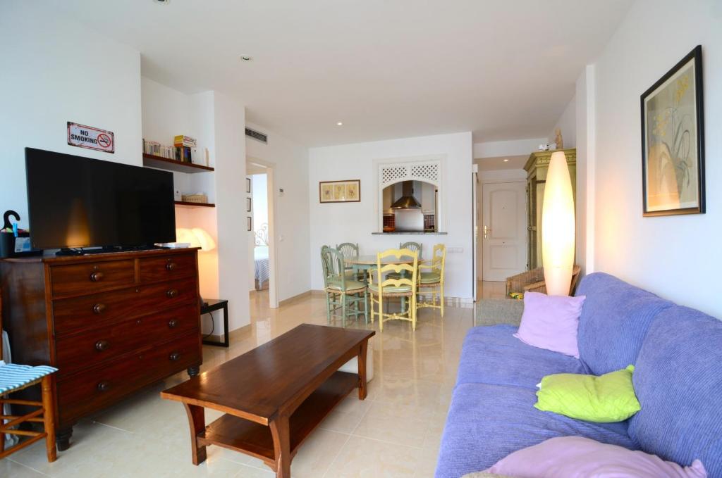 A television and/or entertainment centre at Brises del Mar 3-1