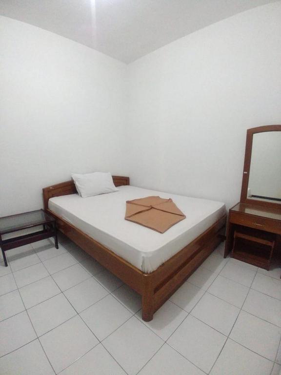 Postel nebo postele na pokoji v ubytování Hotel Baru Inn Batu RedPartner