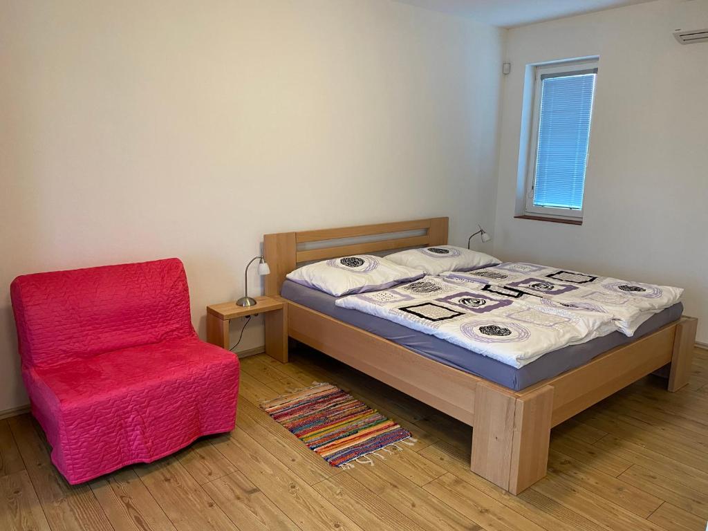 Postel nebo postele na pokoji v ubytování Apartmány Přítluky