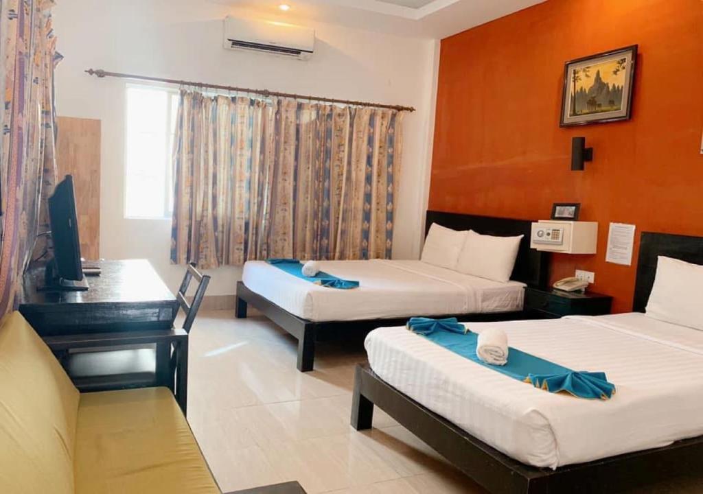 Postel nebo postele na pokoji v ubytování Best Central Point Hotel