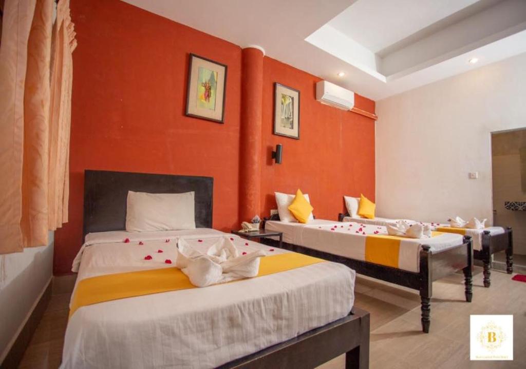 Postel nebo postele na pokoji v ubytování Best Central Point Hotel