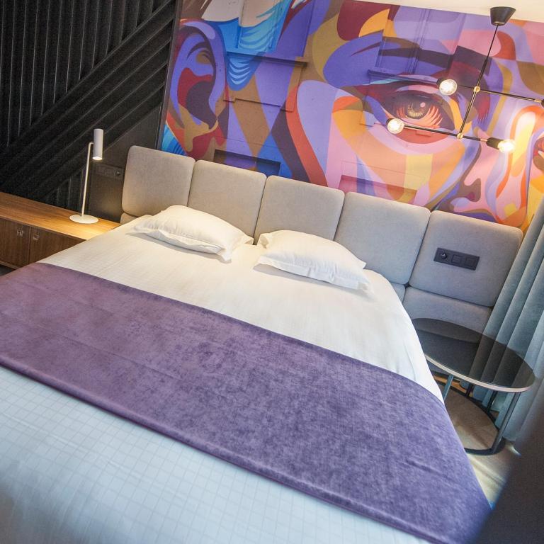 Postel nebo postele na pokoji v ubytování Ostend Hotel