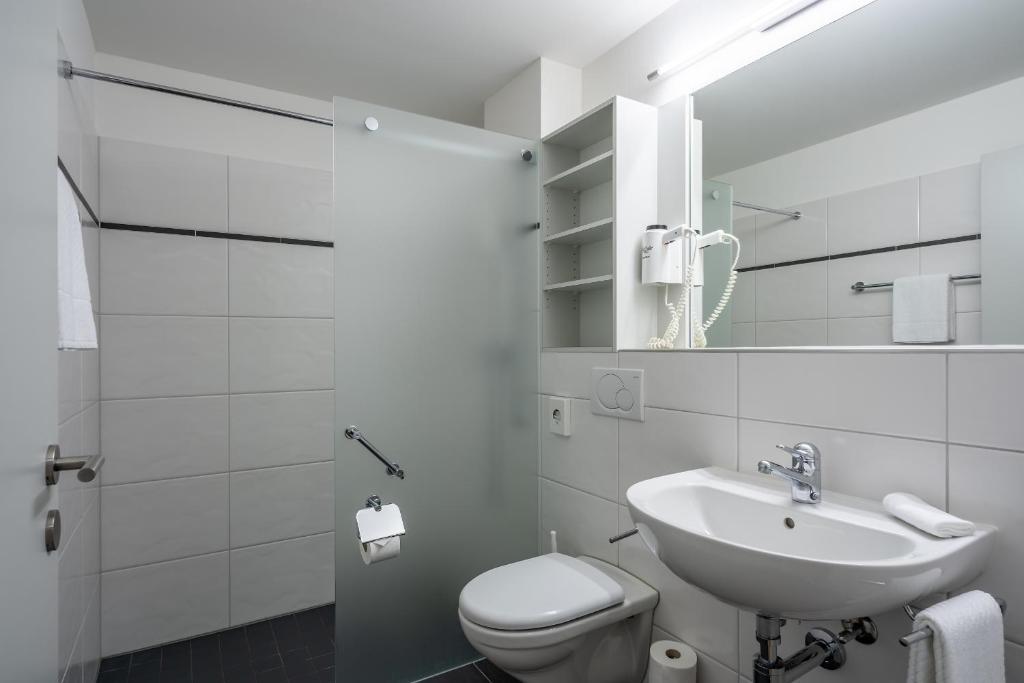 Koupelna v ubytování Hotel Artos Interlaken