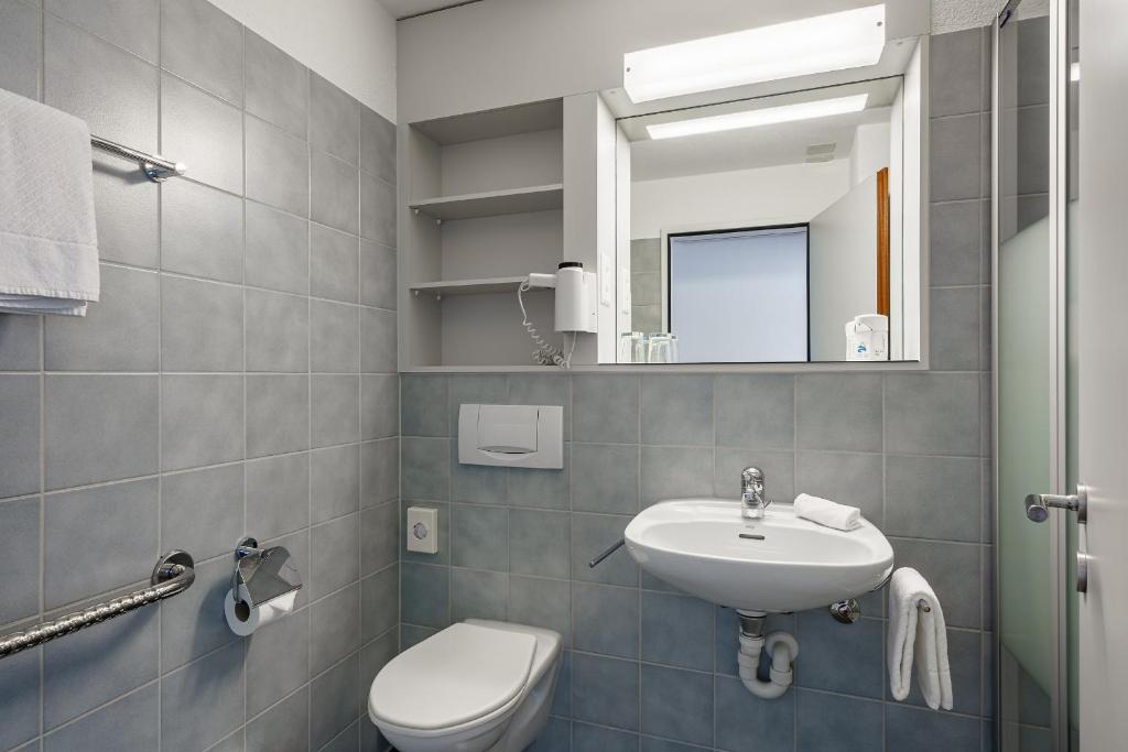 Koupelna v ubytování Hotel Artos Interlaken