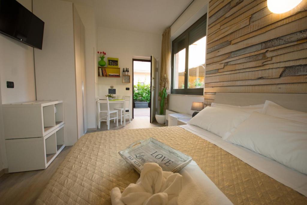 Tempat tidur dalam kamar di Alba Serena Camere