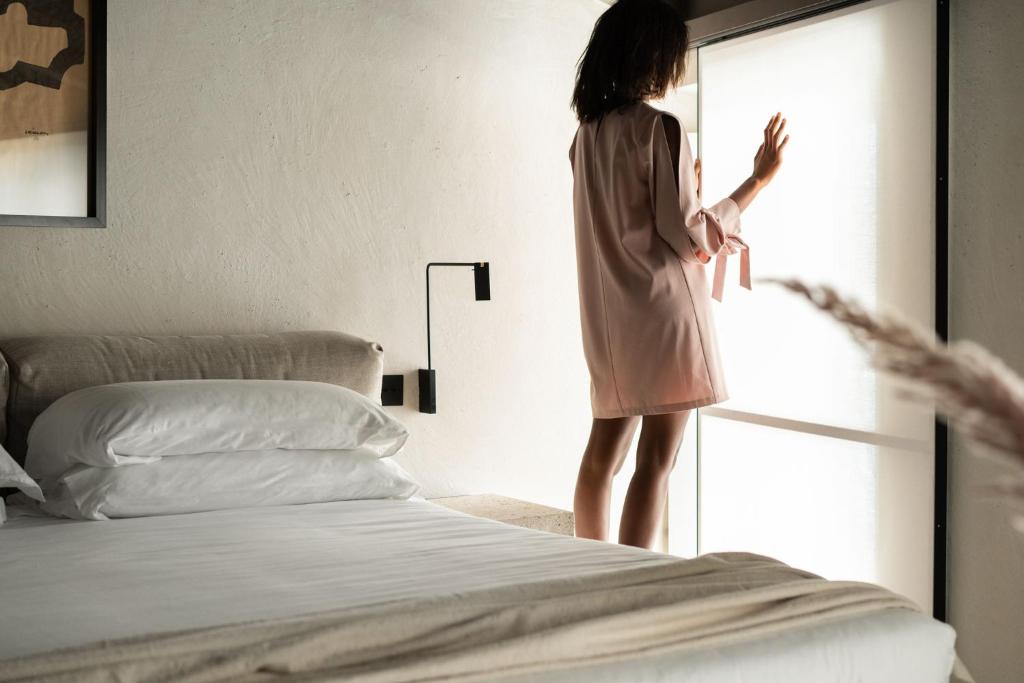 Postel nebo postele na pokoji v ubytování Hotel Scenario