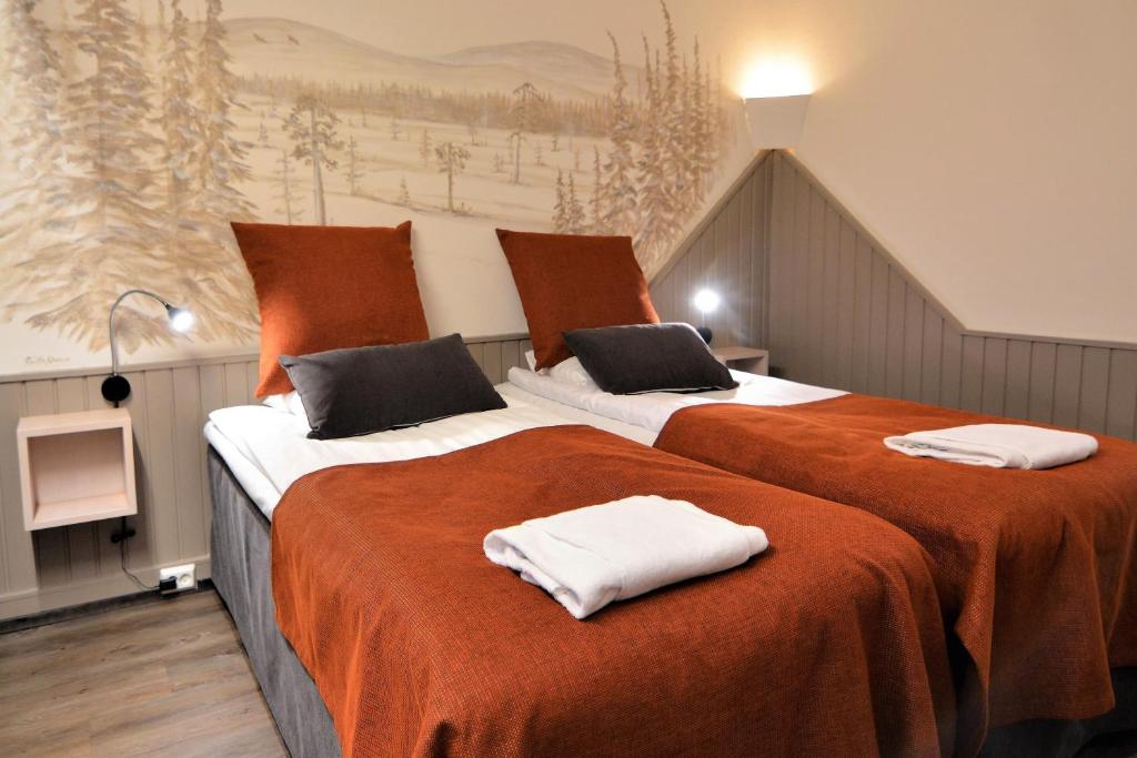 Postel nebo postele na pokoji v ubytování Hotel Ylläsrinne