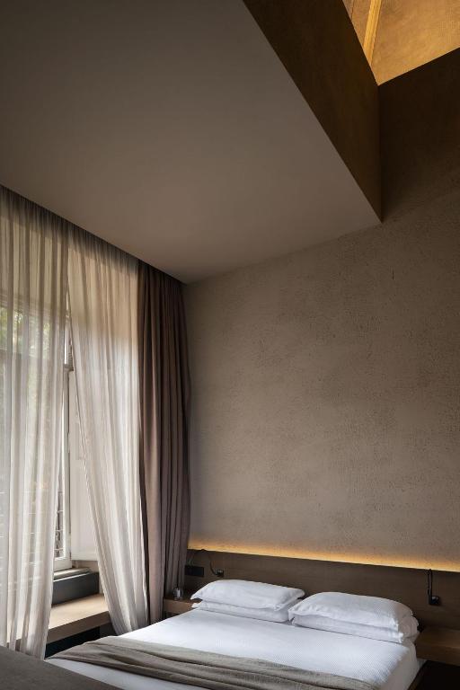 Postel nebo postele na pokoji v ubytování Hotel dei Barbieri
