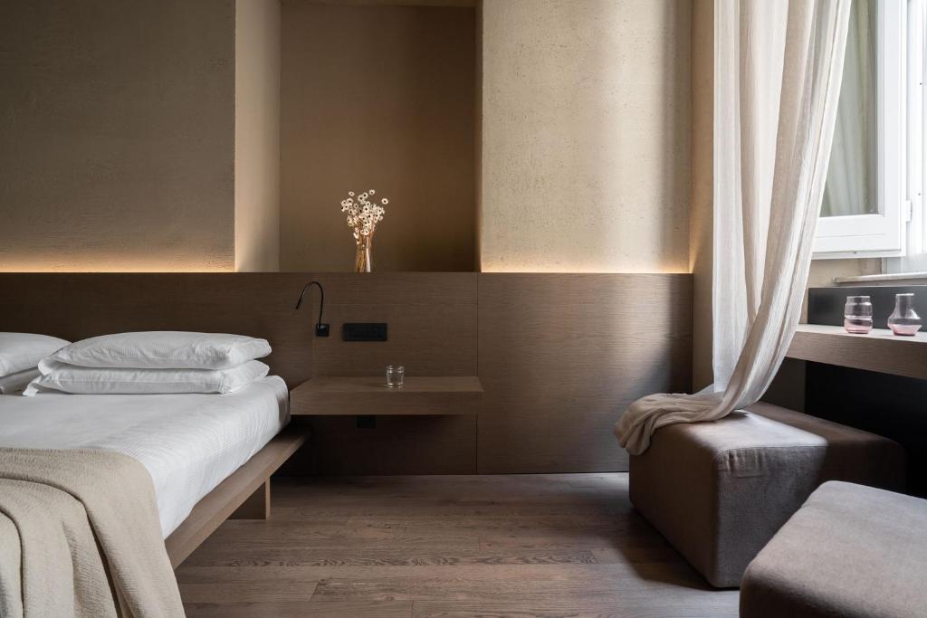Postel nebo postele na pokoji v ubytování Hotel dei Barbieri