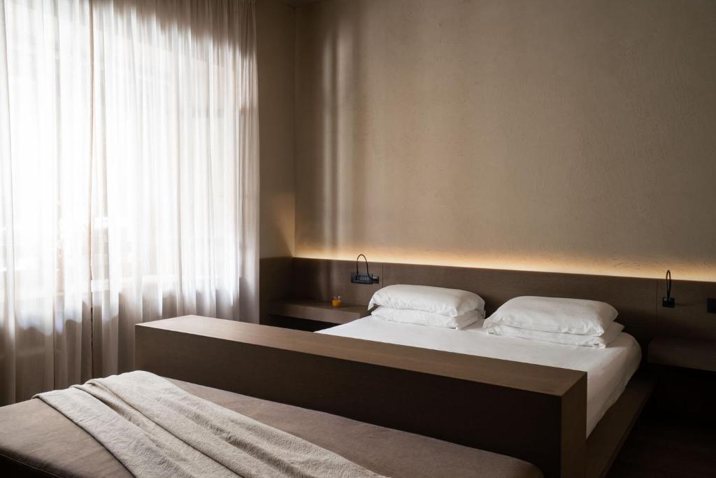 Postel nebo postele na pokoji v ubytování Hotel dei Barbieri